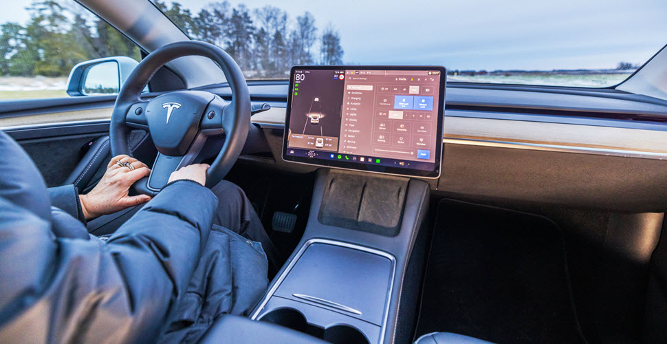 Man Driving Tesla Car